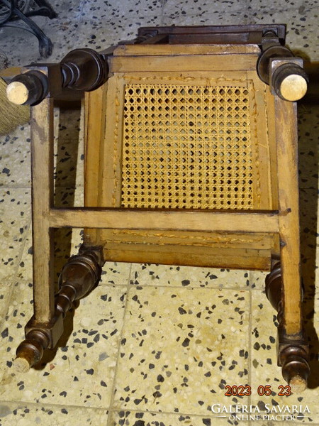 A pair of pewter wicker dining chairs with backs