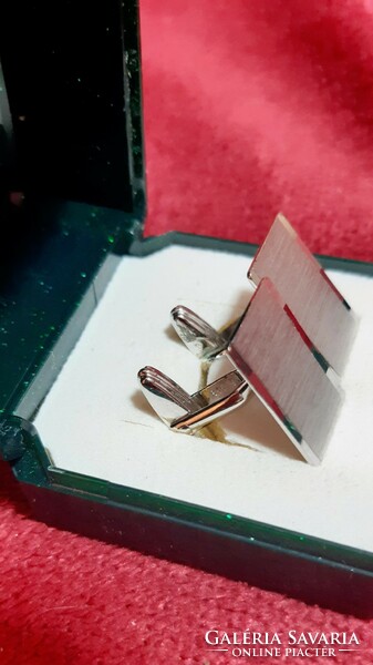 Silver cufflinks made by an individual jeweler