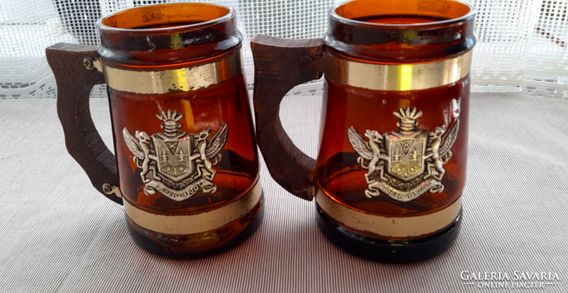 Brown glass beer mug with wooden handle