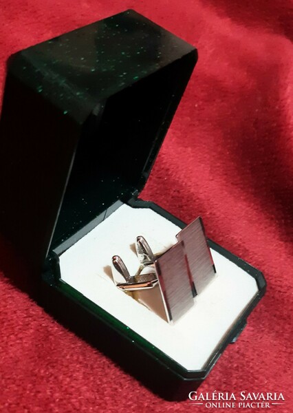 Silver cufflinks made by an individual jeweler
