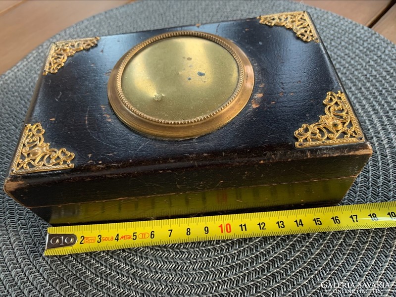 Antique wooden box with copper hammer