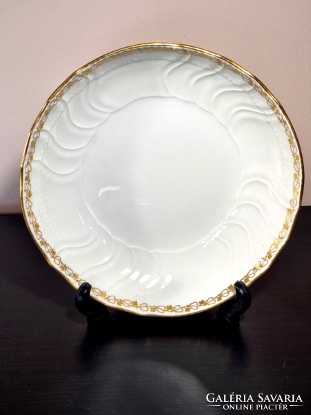 *Kpm Berlin porcelain plate, decorated with a gilded border, around the middle of the 19th century.