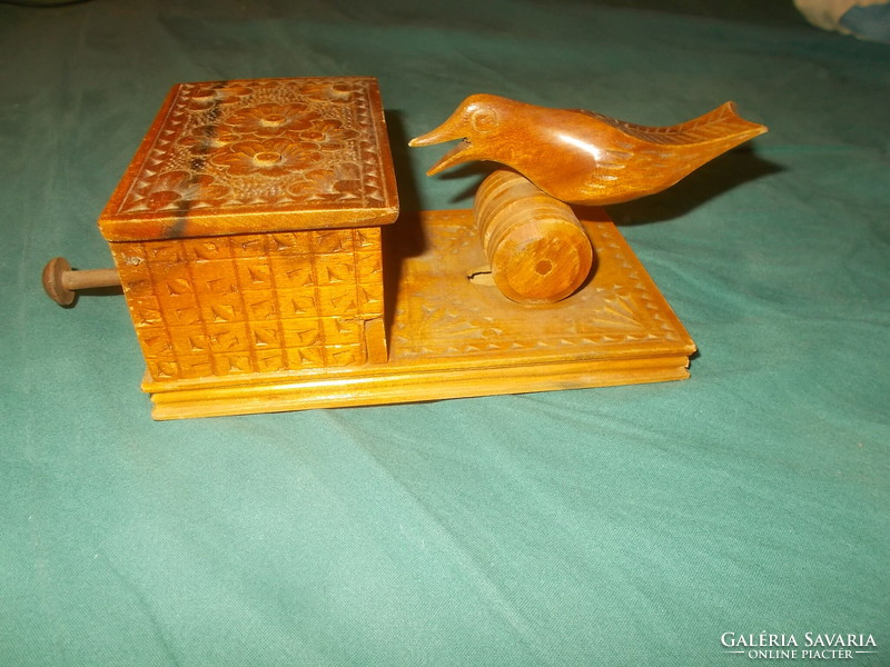 Old carved wooden cigarette holder with birds