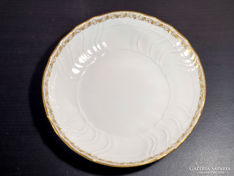 *Kpm Berlin porcelain plate, decorated with a gilded border, around the middle of the 19th century.