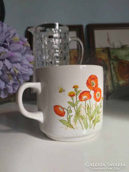 Ceramic mug with a charming floral bee illustration