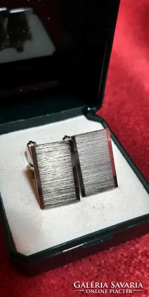 Silver cufflinks made by an individual jeweler