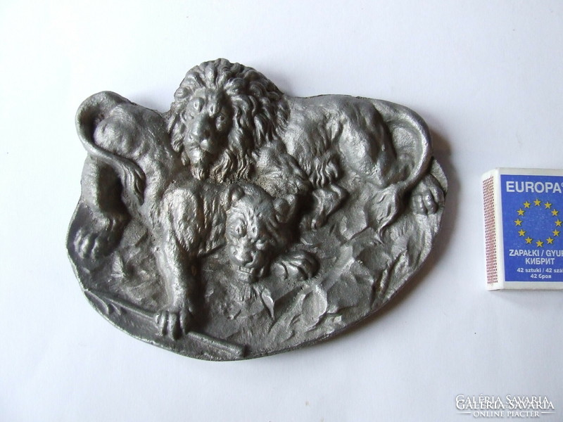 Old aluminum business card holder with lion decoration, relief