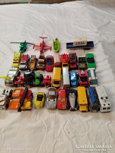 About 30 matchbox cars, etc. in mixed condition for sale