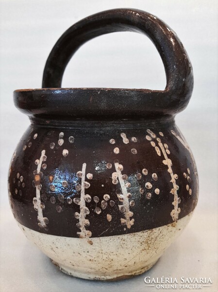 Antique folk earthenware pot with ears
