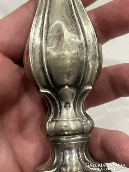 Silver candle holder. In bad condition.