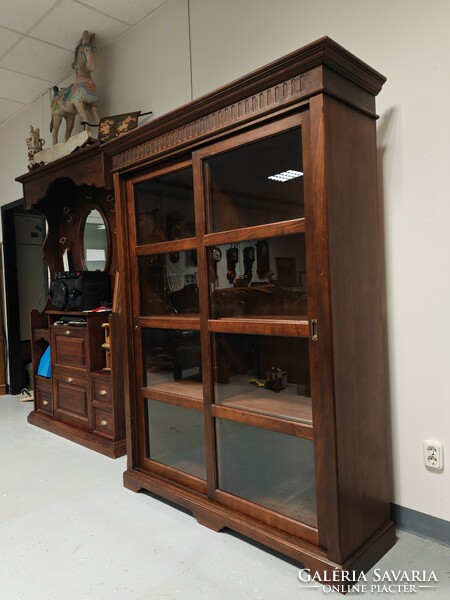Solid wood Tuscan living room display bookcase with sliding doors in very nice condition.