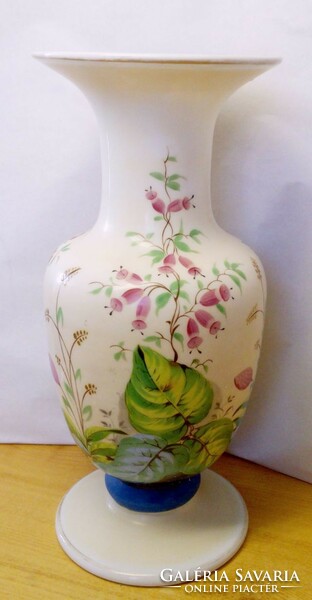 Antique glasswork rarity. A beautiful milk glass vase with floral patterns from the 19th century. From the end of the century