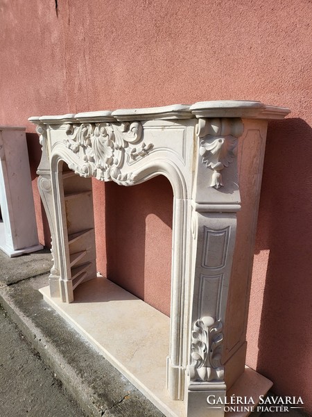 Beige carved marble fireplace