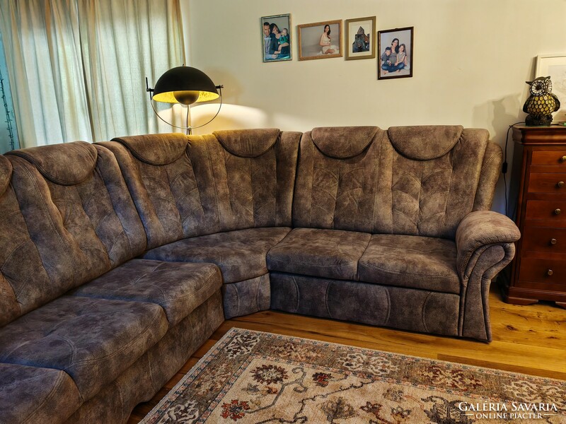 Upholstered with premium fabric, a new one-year-old openable corner sofa set in perfect condition