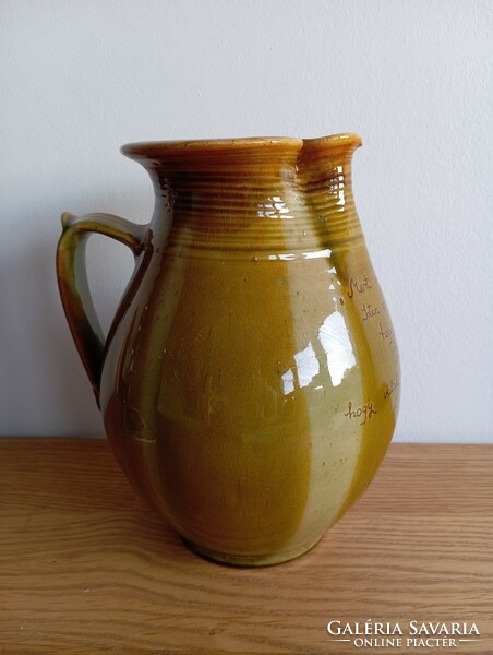 Folk ceramic jug with a biblical quote.