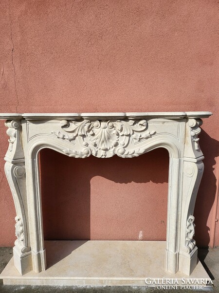 Beige carved marble fireplace