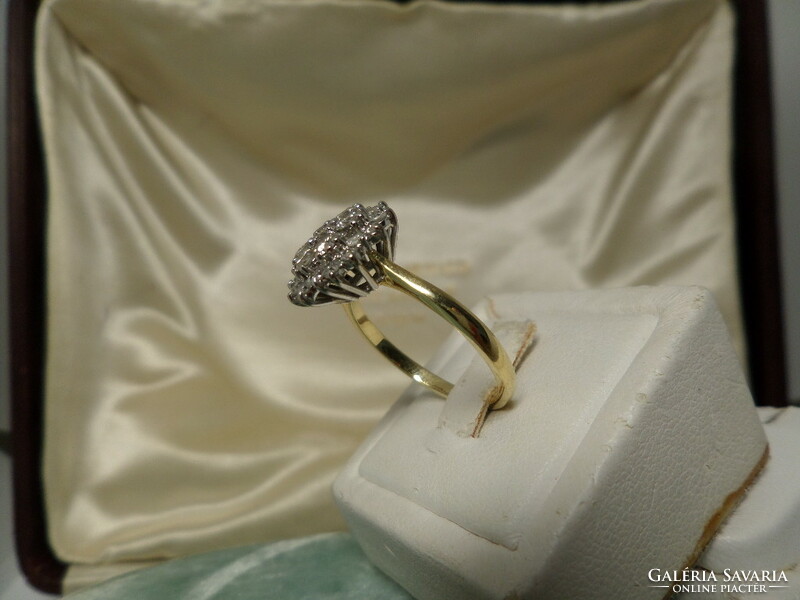 18K gold ring with many diamonds