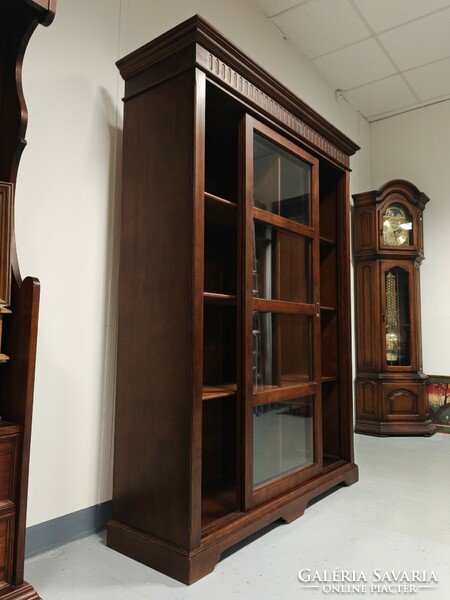 Solid wood Tuscan living room display bookcase with sliding doors in very nice condition.