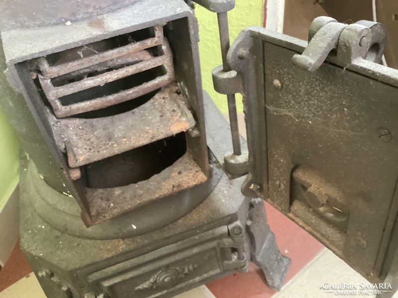 Old antique cylindrical iron stove