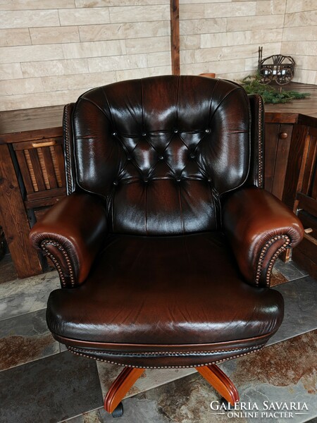 Large classic genuine leather chesterfield swivel armchair in excellent condition