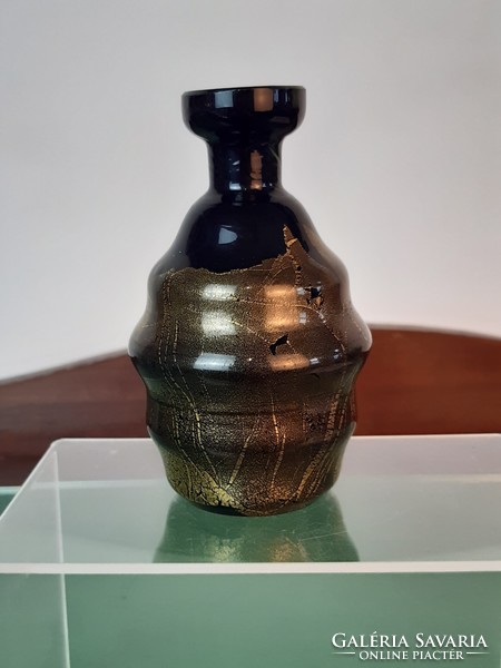 Black glass vase decorated with gold smoke