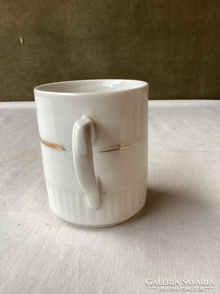 Zsolnay porcelain mug with golden stripes.