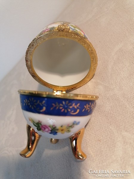 Wooden egg-shaped porcelain jewelry holder with a hinged lid.