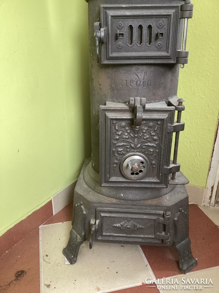 Old antique cylindrical iron stove