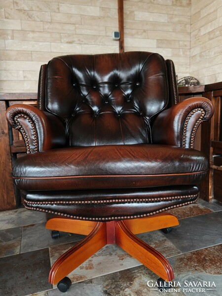 Large classic genuine leather chesterfield swivel armchair in excellent condition