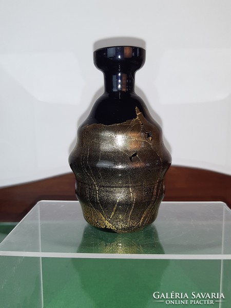 Black glass vase decorated with gold smoke