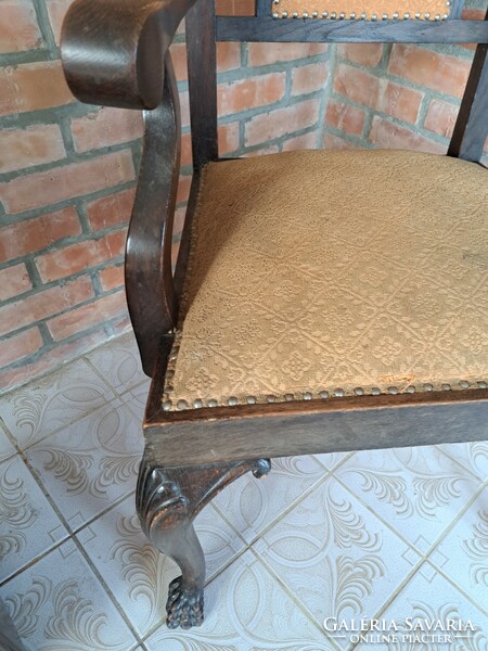 Antique carved lion-legged armchair