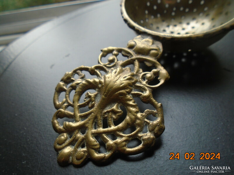 Decorative copper openwork casting with tongs, filter