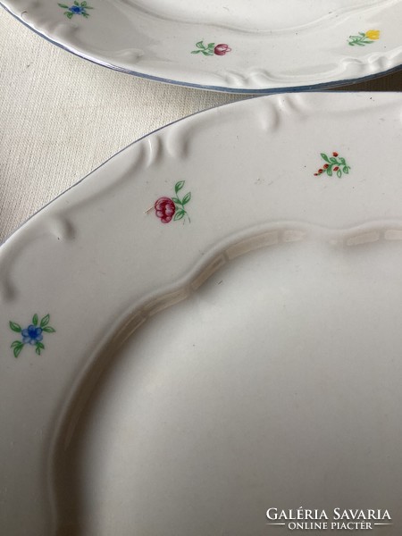 Four small flowered porcelain flat plates from Zsolna.