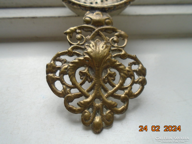 Decorative copper openwork casting with tongs, filter