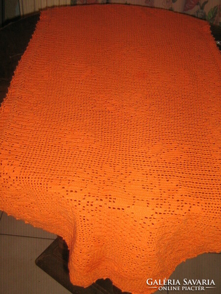 Beautiful handmade crochet orange tablecloth