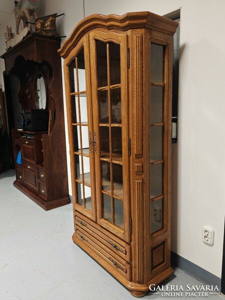 Oak two-door, two-drawer display cabinet in immaculate condition.