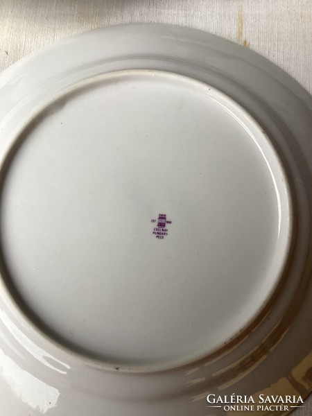 Four small flowered porcelain flat plates from Zsolna.