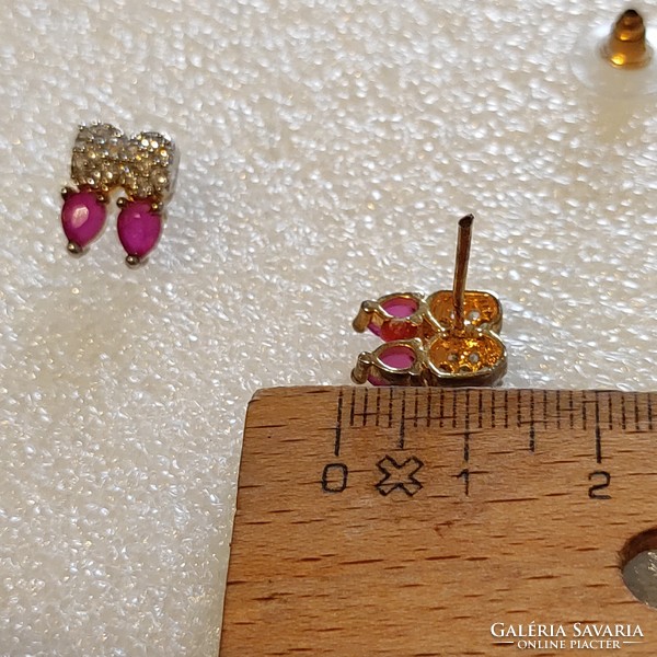 Used metal earrings with ruby stones in good condition