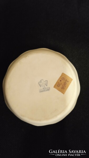 A tiny aquvinkum porcelain bowl with a rose pattern