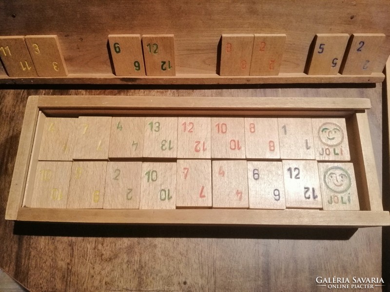 Old board rummy in a wooden box with wooden cards