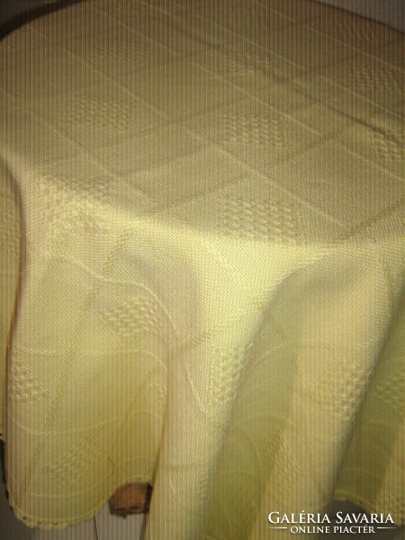 Woven tablecloth with a beautiful yellow lacy edge