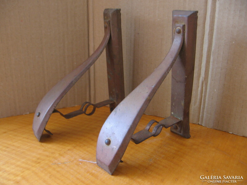 A pair of Art Nouveau curtain rod holders, iron and copper