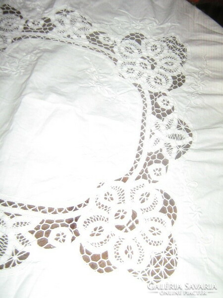 Wonderful ribbon embroidered on special snow-white lace tablecloth