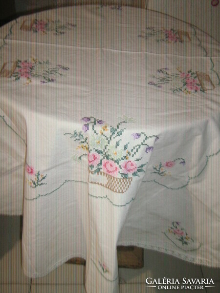 Beautiful floral oval tablecloth with a lace edge embroidered with small cross stitches