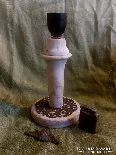 Marble lamp, self-lighter with gamma inscription, and putto head for sale together