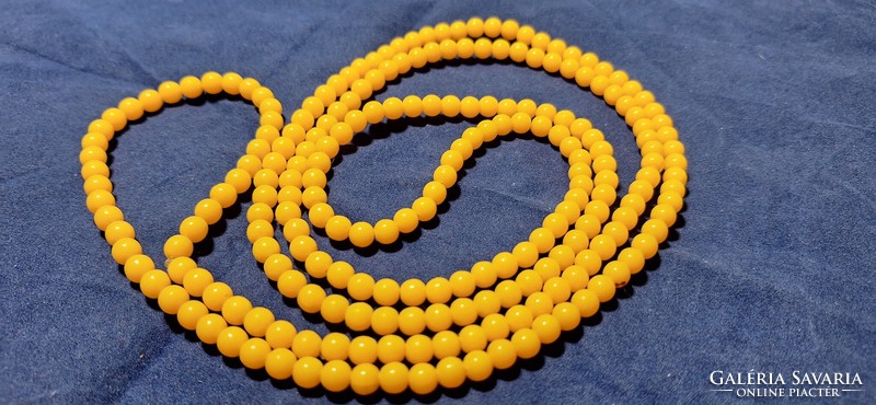 Vintage amber yellow plastic string extra long