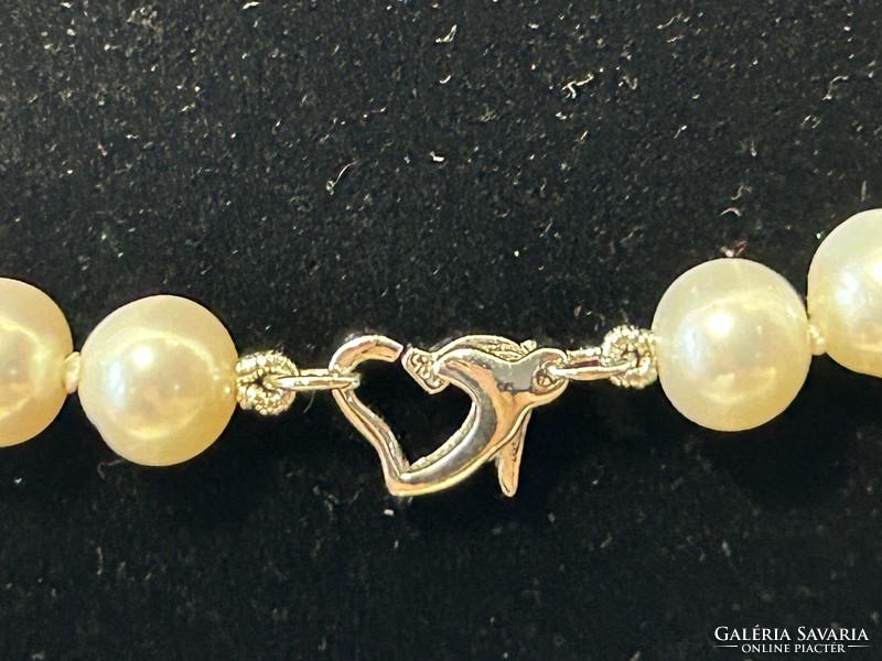 A real string of pearls with marked silver clasp, a dazzling piece