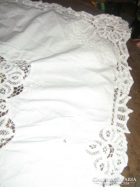 Wonderful ribbon embroidered on special snow-white lace tablecloth