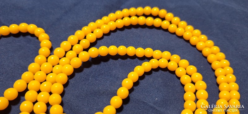 Vintage amber yellow plastic string extra long