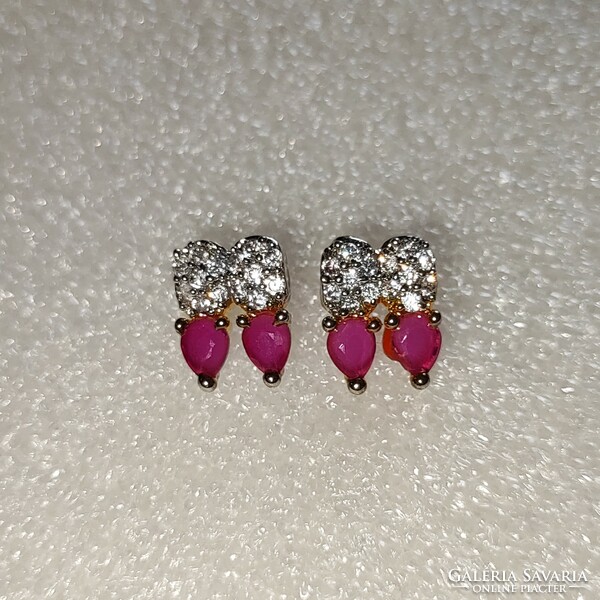 Used metal earrings with ruby stones in good condition